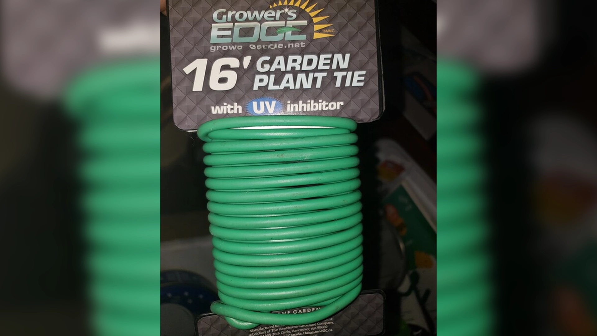 Coiled green garden plant tie, 16 feet long, with UV inhibitor, packaged by Grower's Edge.